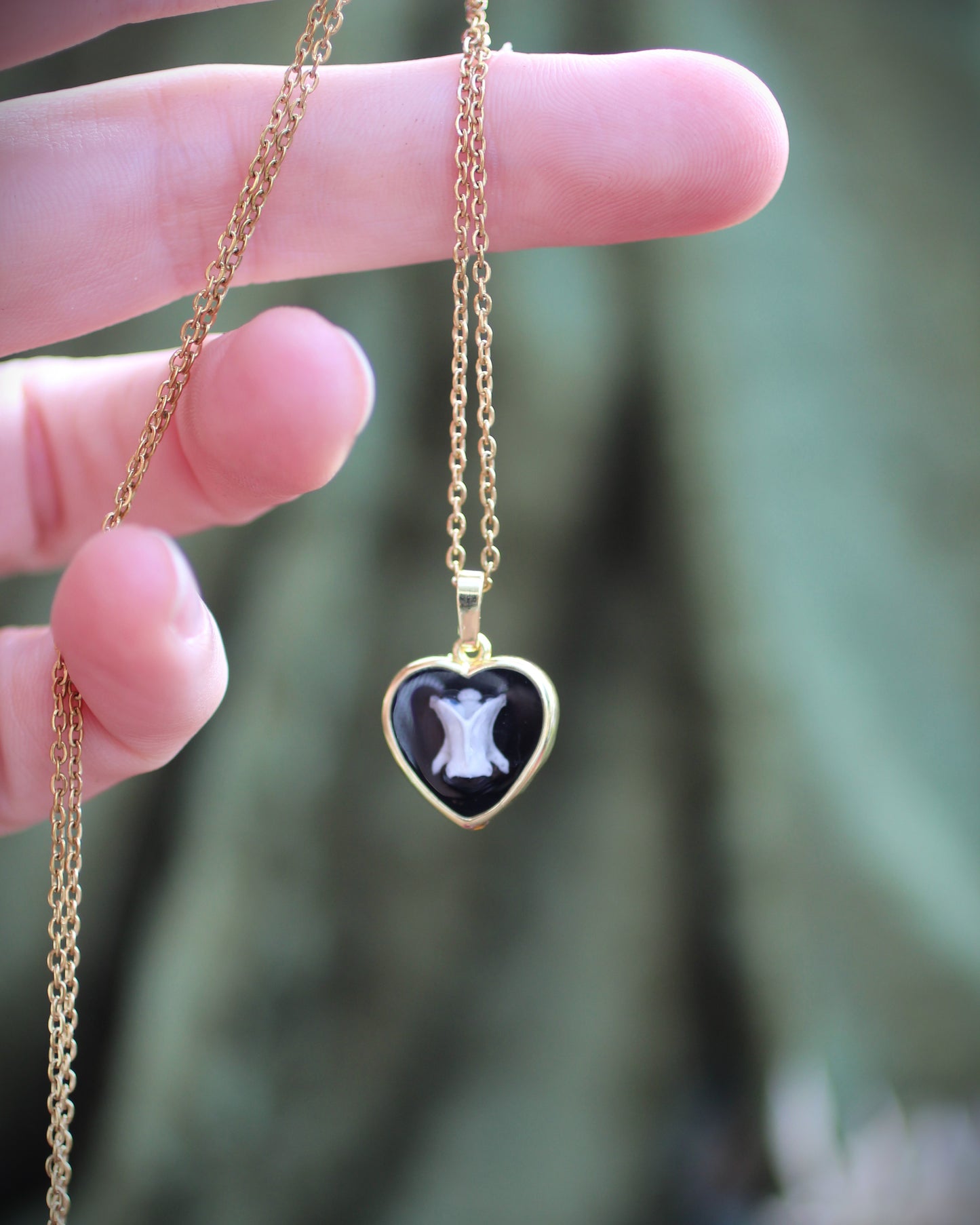 Tooth and Bone Heart Necklaces