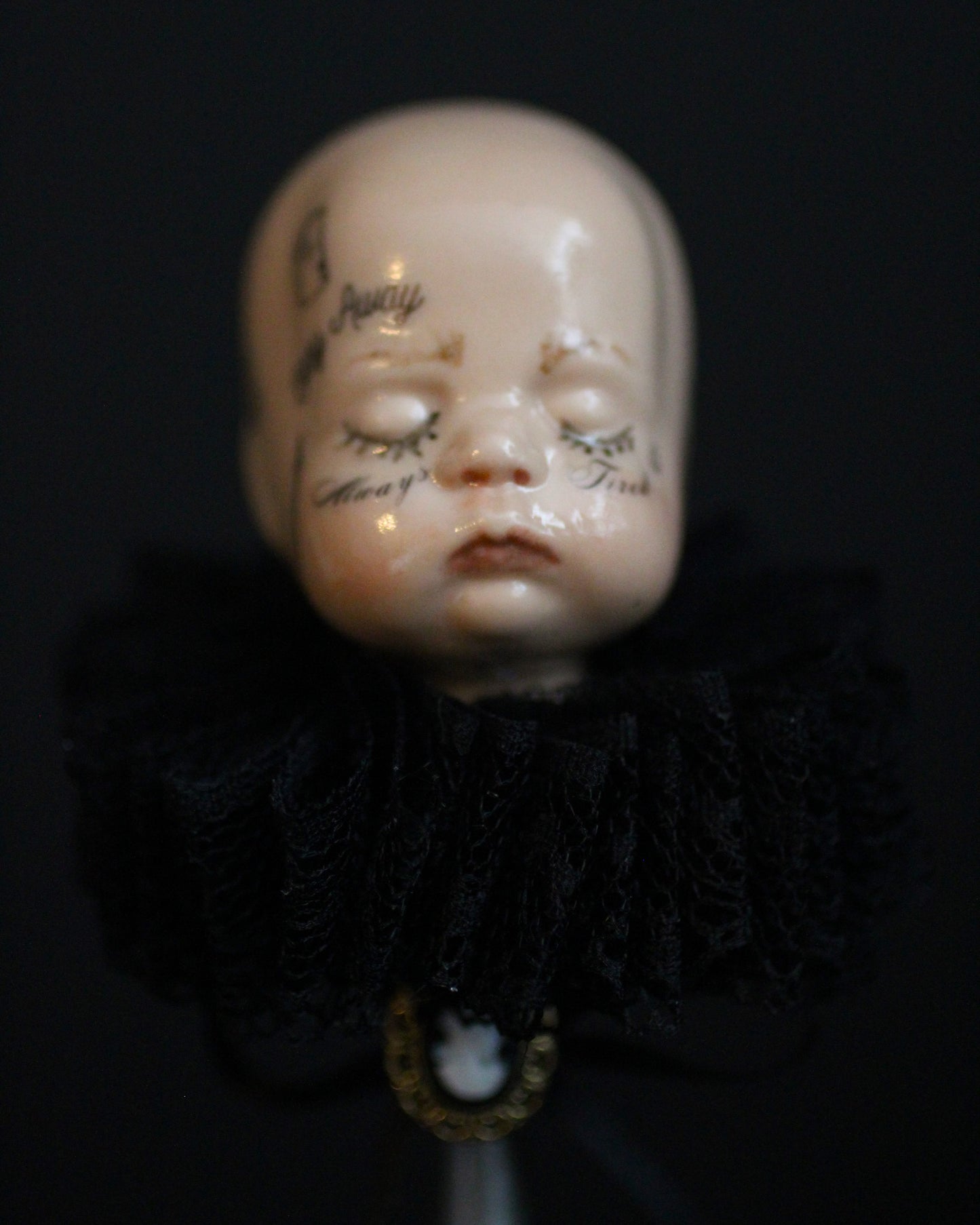 Always Tired Doll Head Sculpture