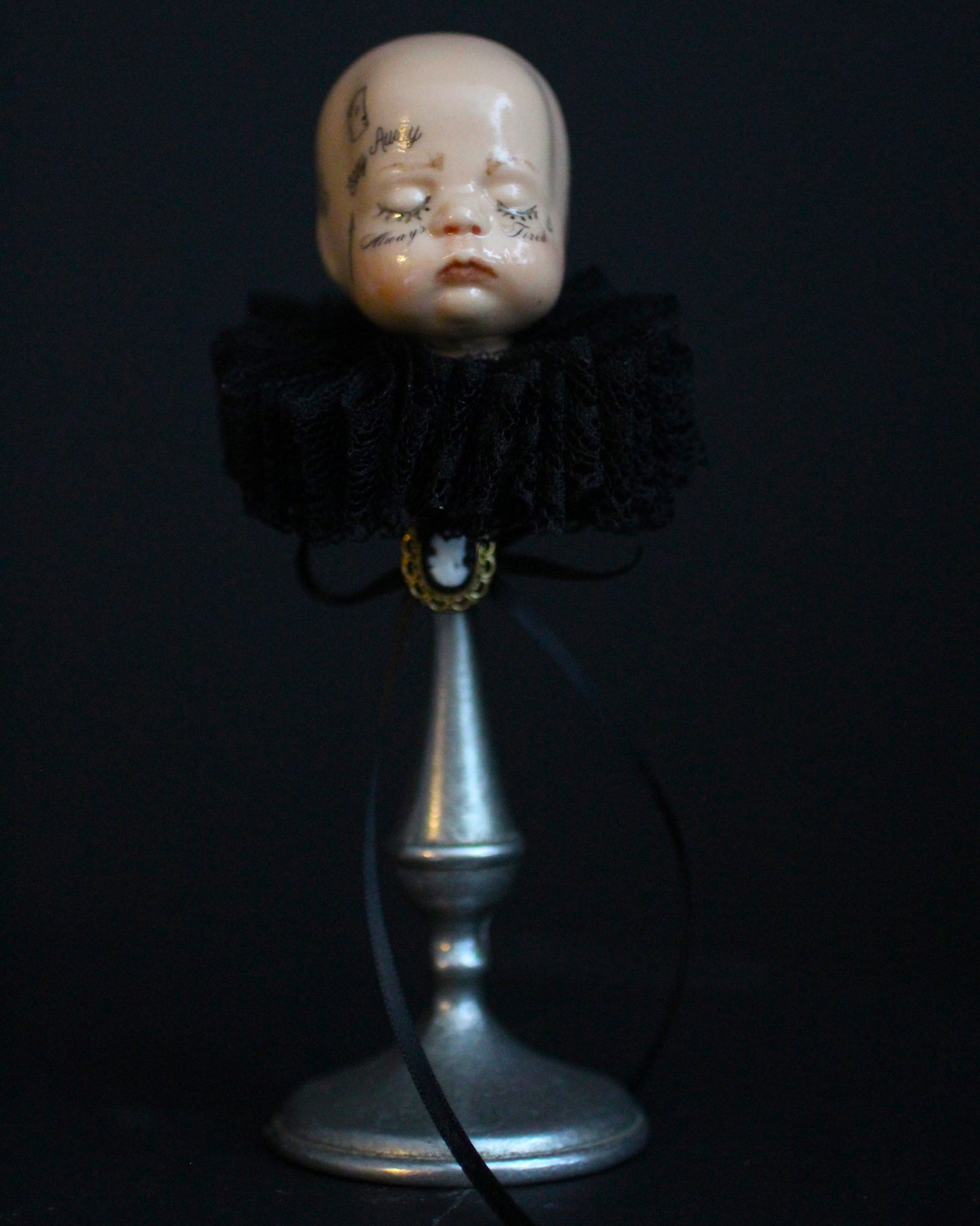 Always Tired Doll Head Sculpture