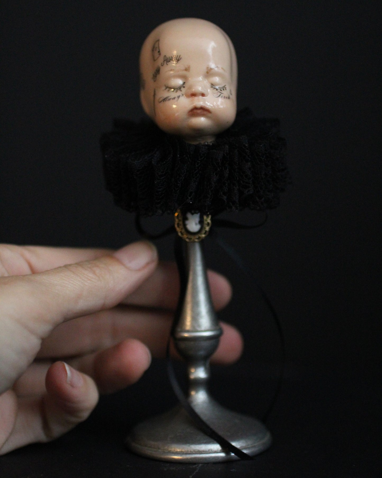 Always Tired Doll Head Sculpture