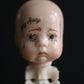 Spinal Column Doll Head Sculpture