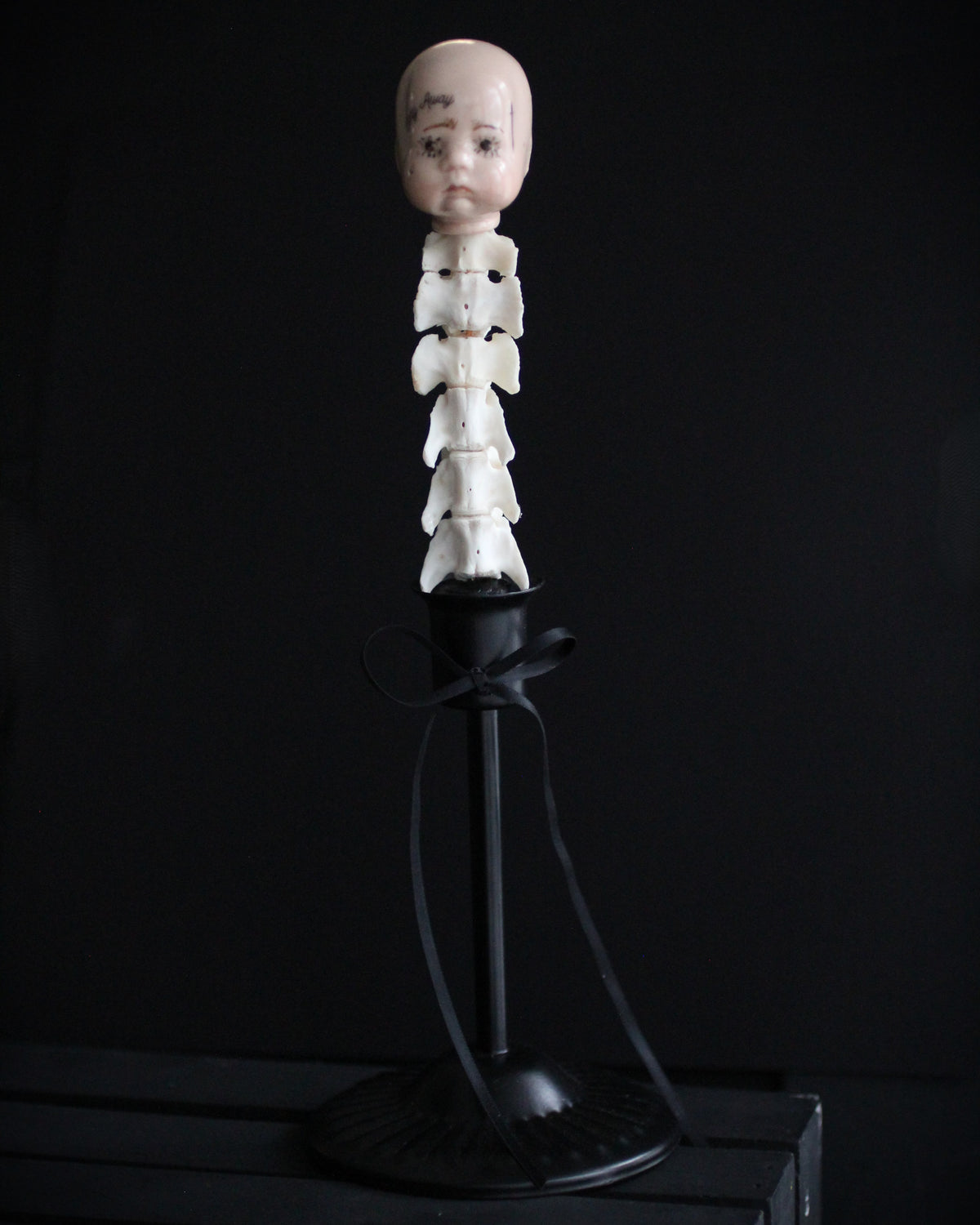 Spinal Column Doll Head Sculpture