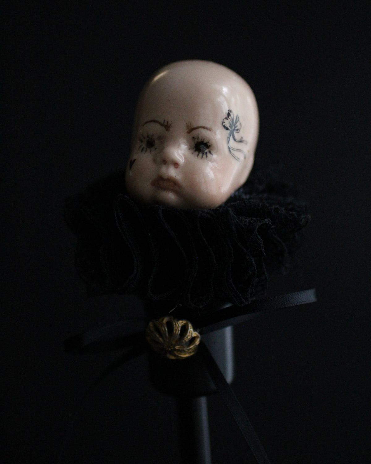 Black Candlestick Doll Head Sculpture